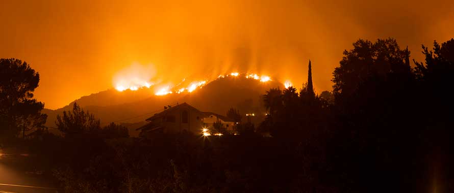 wildfire approaches neighborhood