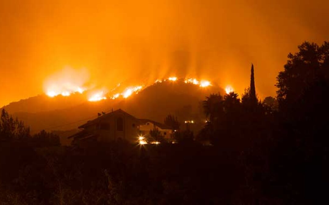 wildfire approaches neighborhood