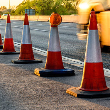 Semi-Truck Strikes Crane Resulting in Highway Construction Tragedy