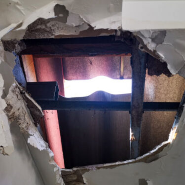 Mysterious Object Falls from Sky, Damaging Roof of Small Business