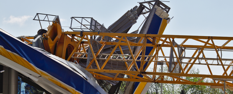 Crane Collapses at YMCA Construction Site, Narrowly Missing Driver